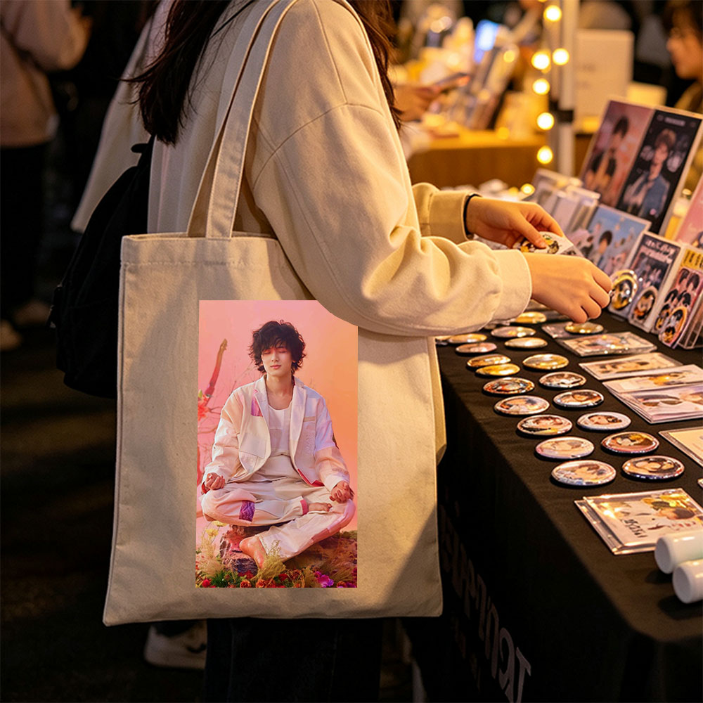 Takuya Kimura Meditating in a Serene Floral Garden with Soft Pink and Orange Background - Canvas tote bags