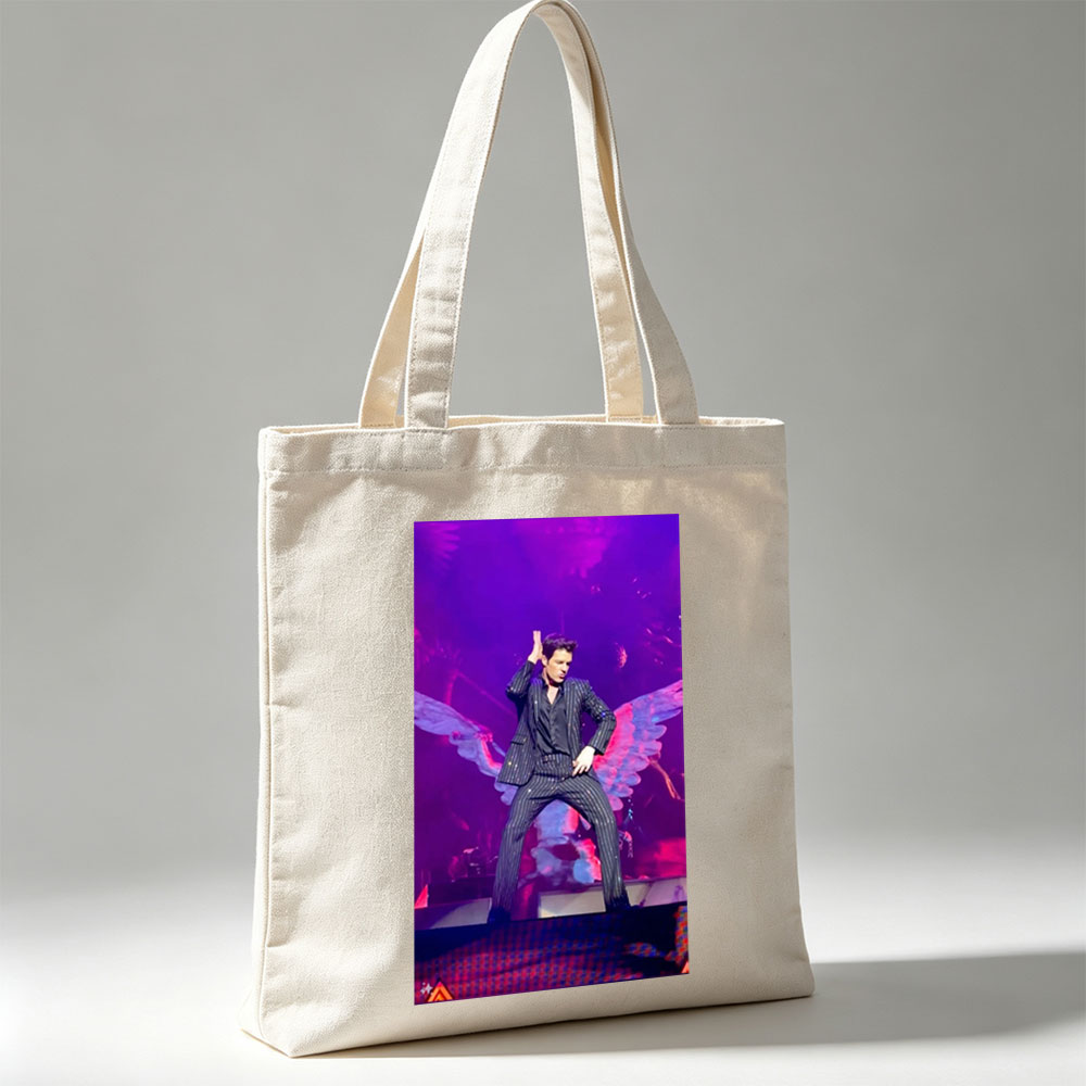 Adam Lambert on Stage in a Striped Suit with Dramatic Wing Props Under Purple Lighting - Canvas tote bags