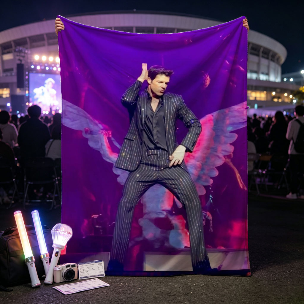 Adam Lambert on Stage in a Striped Suit with Dramatic Wing Props Under Purple Lighting - Blankets