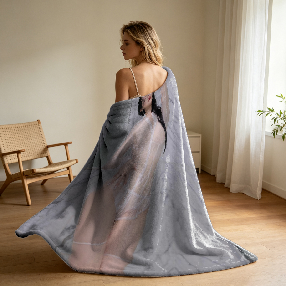 A woman in a sheer white blouse posing seductively on a couch. - Blanket