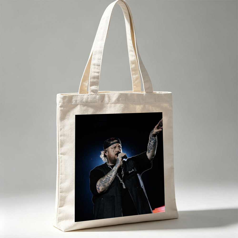 Jelly Roll Performing on Stage with Microphone and Tattooed Arms - Canvas tote bags