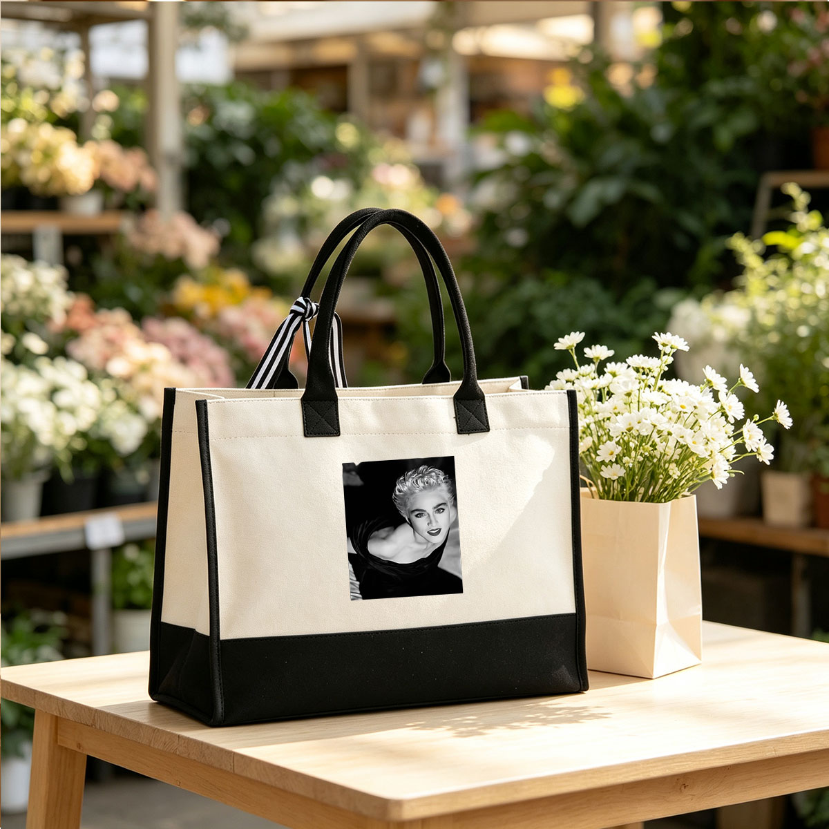Madonna in a striking black and white portrait, showcasing bold makeup and voluminous blonde hair. - Canvas patchwork gift tote bag