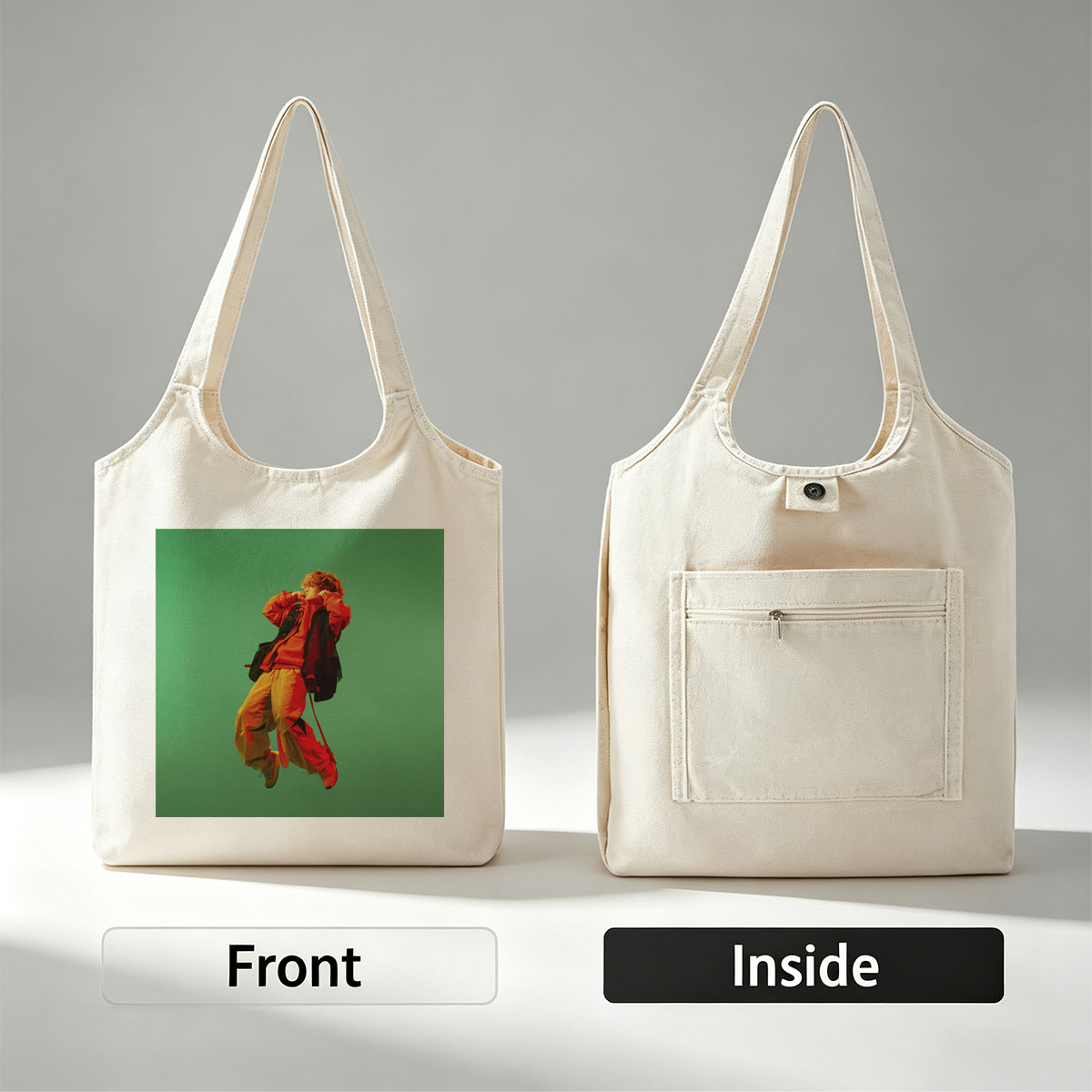 Troye Sivan in a vibrant red and yellow outfit mid-jump against a green background - Canvas shoulder bags/