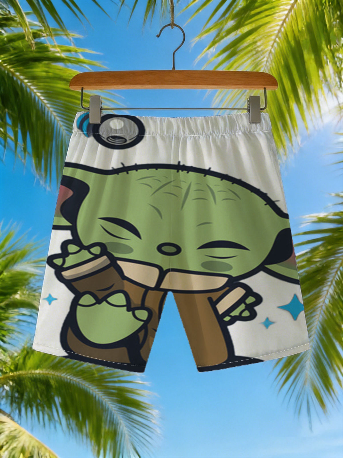 Baby Yoda Hugging a Cup with Stars and Droid in Background -  Beach shorts