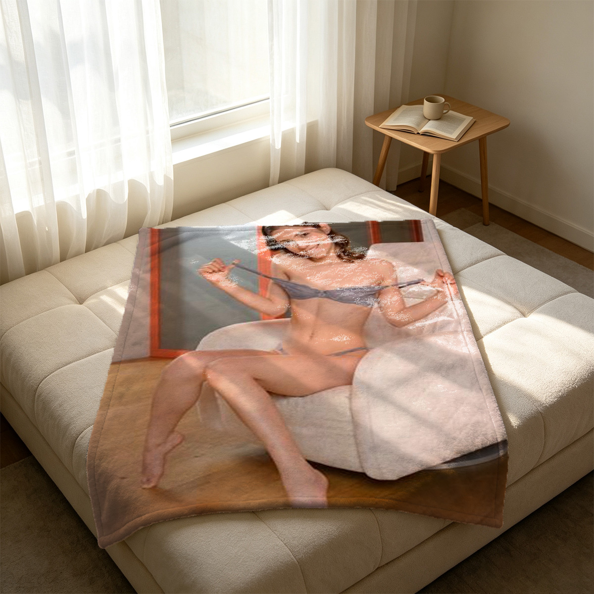 A beautiful Asian woman in black strappy cut-out fishnet lingerie lying seductively on a green couch. - Blanket