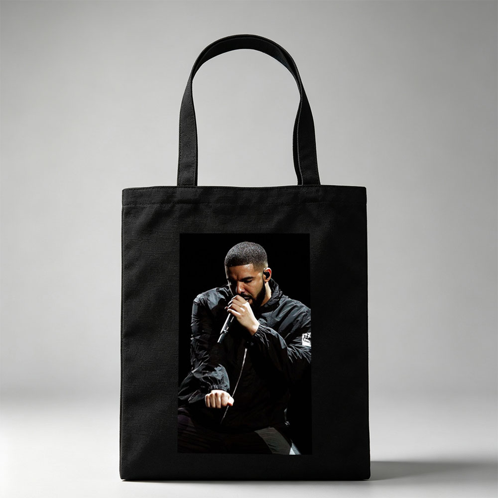 Drake Performing on Stage Holding Microphone in Black Jacket - Canvas tote bags