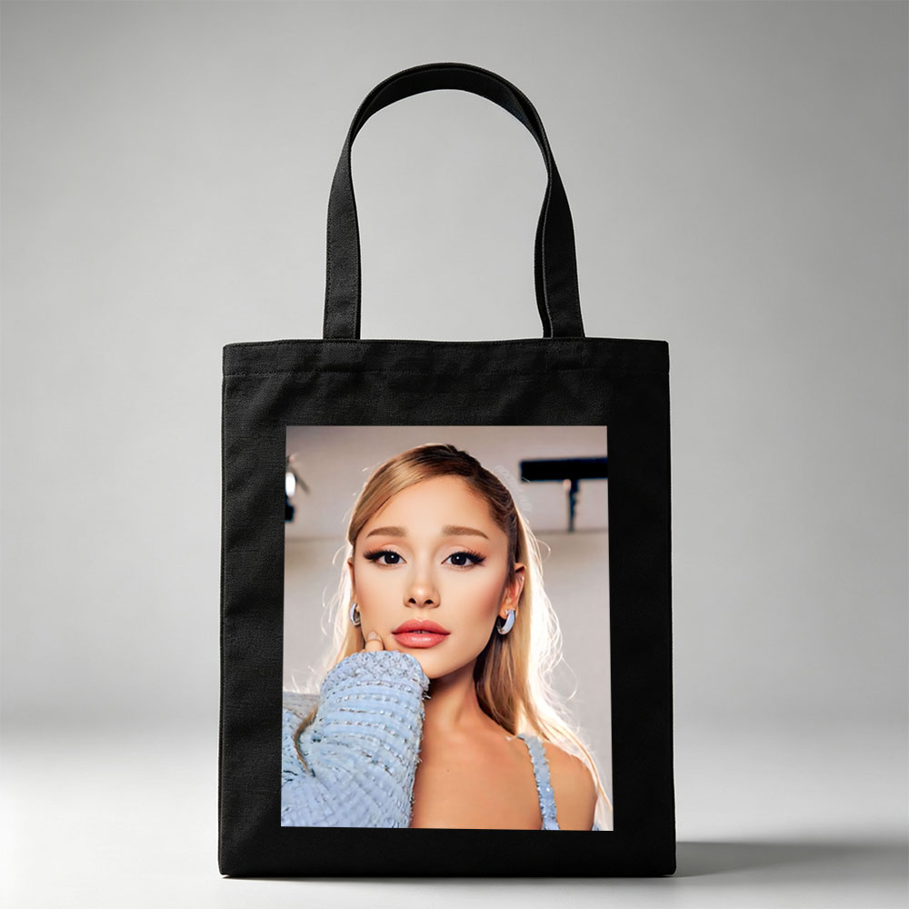 Ariana Grande in a Serene Moment Wearing a Light Blue Textured Top and Elegant Earrings - Canvas tote bags