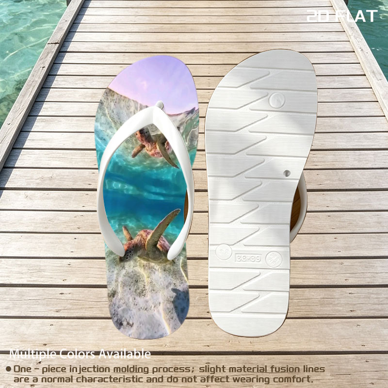 Sea turtles swim gracefully in clear blue waters, one near the surface and one gliding over sandy ocean floor. -  flip-flops