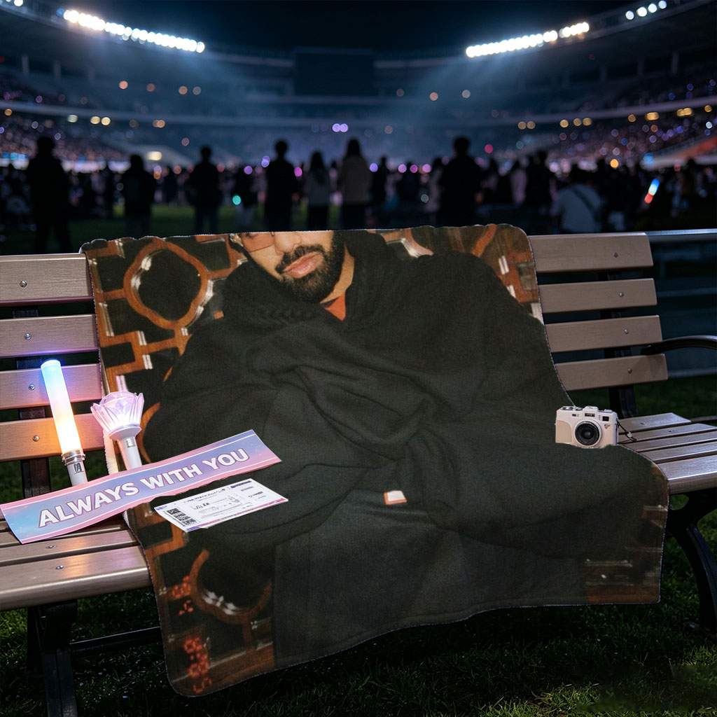Drake in a Stylish Pose Against an Ornate Background Wearing Glasses and a Black Hoodie - Blankets