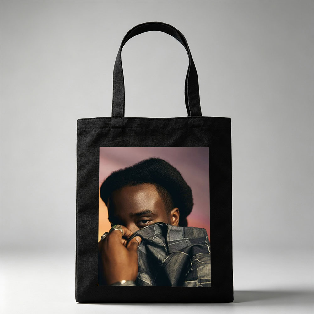 Kendrick Lamar in a Bold Pose Holding Denim Jacket to Face - Canvas tote bags