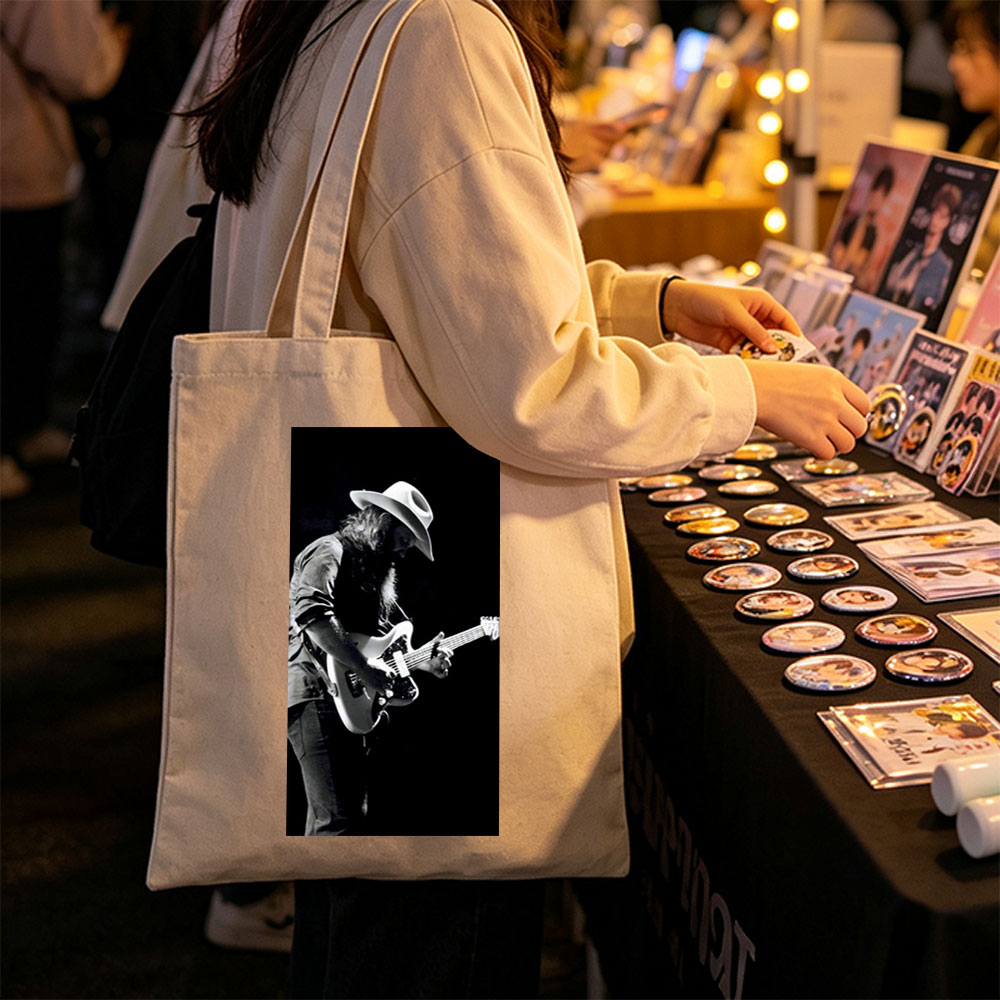 Stevie Ray Vaughan Playing Guitar on Stage in Black and White Photo - Canvas tote bags
