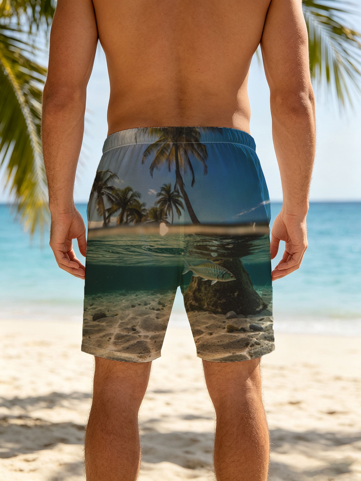 Tropical paradise with palm trees and a fish swimming underwater -  Beach shorts