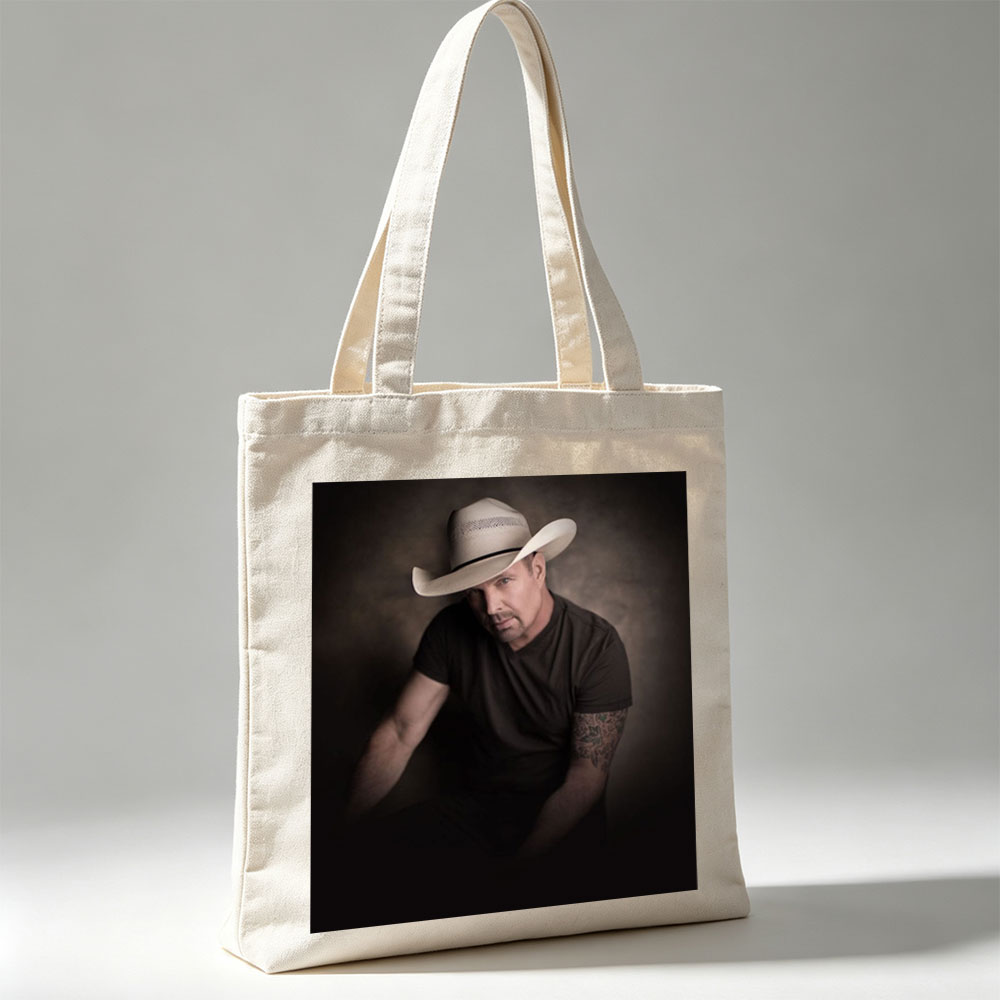 Tim McGraw in a Cowboy Hat - Intense Portrait with Tattooed Arm and Dark Background - Canvas tote bags