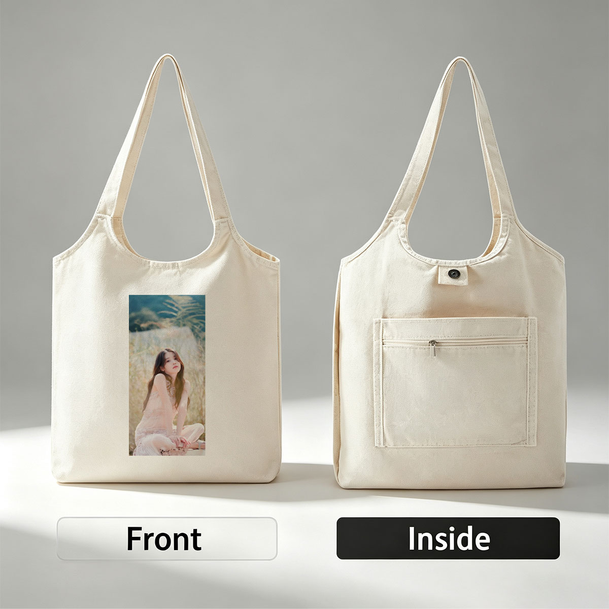 IU in a Serene Field Wearing a Delicate Pink Dress and Sitting Gracefully Amidst Tall Grass - Canvas shoulder bags/