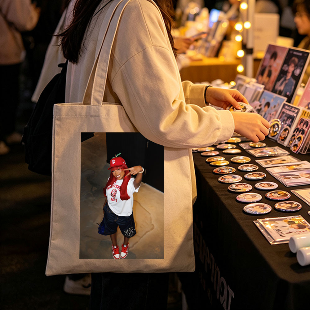 Nicki Minaj in a Red Apple Hat and A Bathing Ape Shirt, Striking a Pose with a Peace Sign - Canvas tote bags
