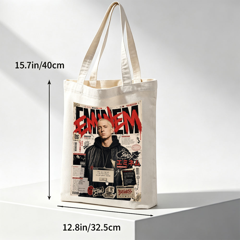 Eminem on a vibrant magazine cover featuring bold red text, career highlights, and iconic album references. - Canvas tote bags