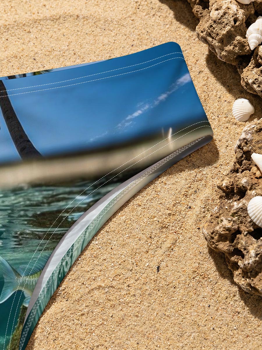 Tropical paradise with palm trees and a fish swimming underwater -  Men's swim trunks