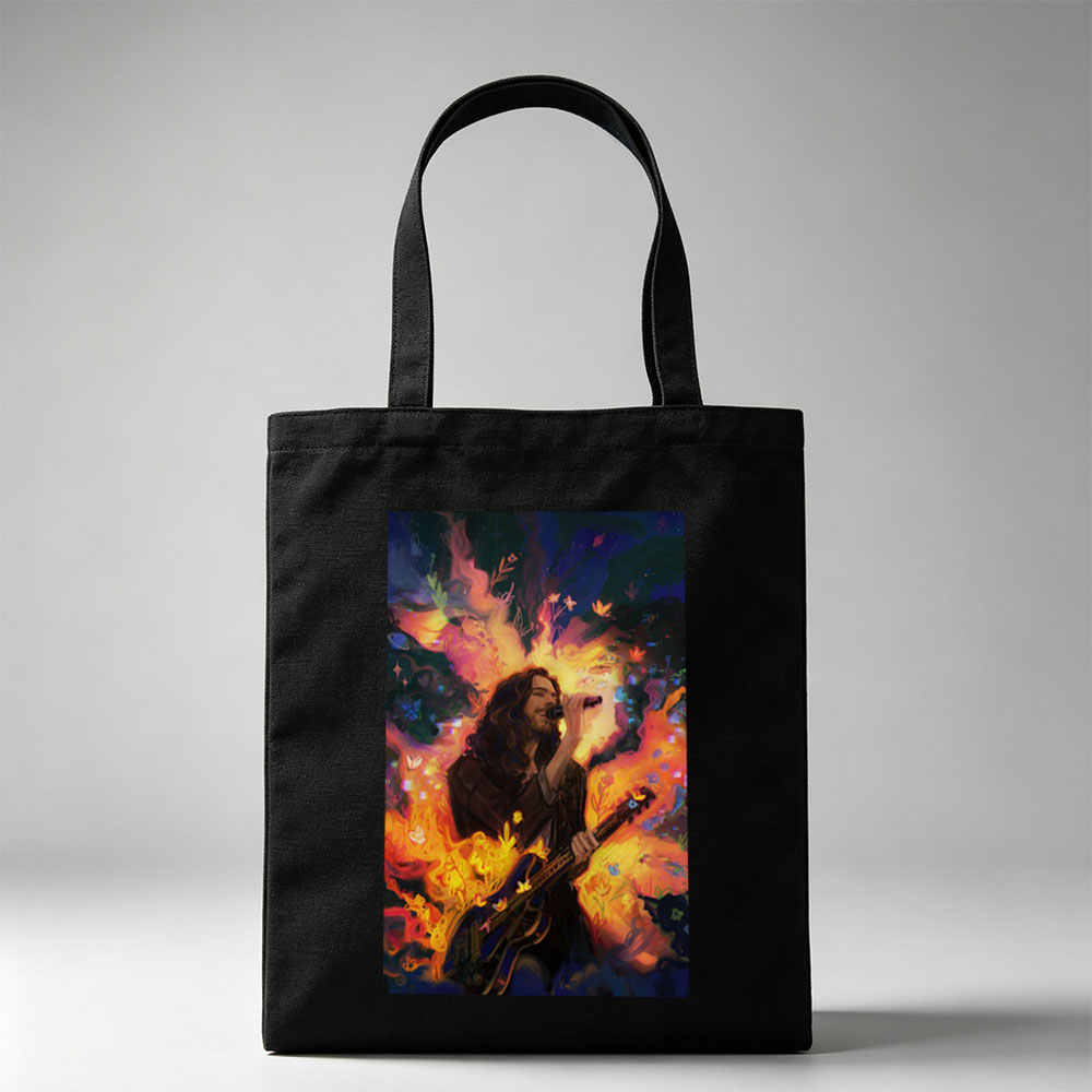 Hozier Performing with Guitar Amidst Vibrant Flames and Flowers Artwork - Canvas tote bags