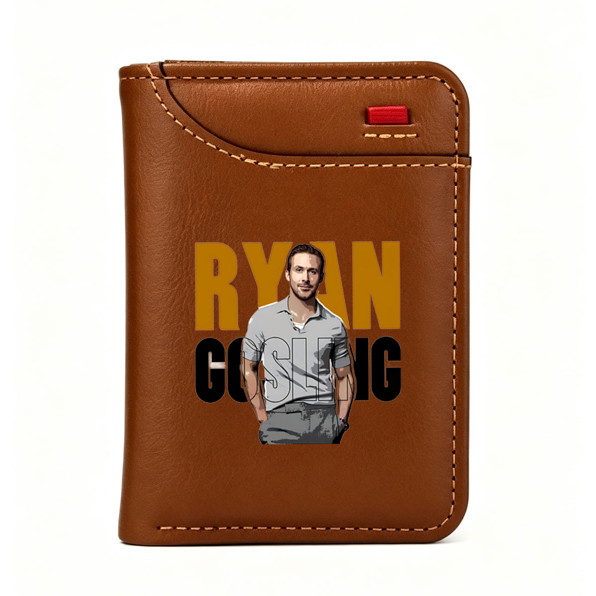 Ryan Gosling in a stylish gray polo shirt, standing confidently with hands in pockets, set against bold text backdrop. - Vertical Style Wallet