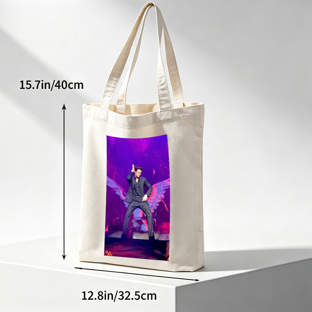 Adam Lambert on Stage in a Striped Suit with Dramatic Wing Props Under Purple Lighting - Canvas tote bags