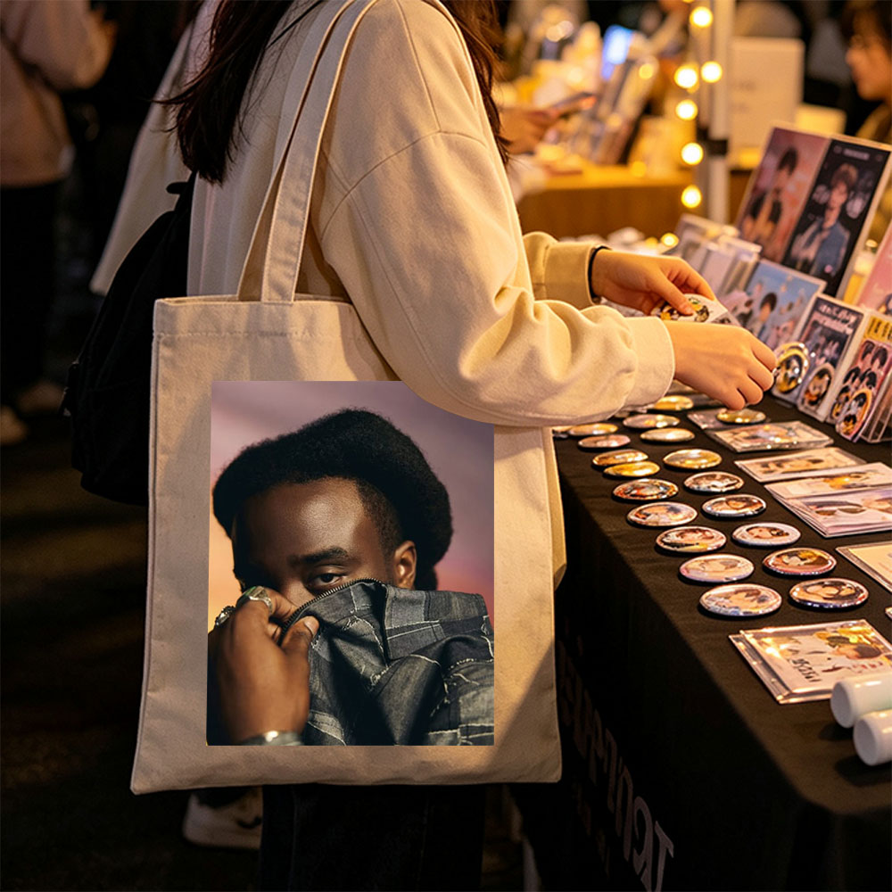 Kendrick Lamar in a Bold Pose Holding Denim Jacket to Face - Canvas tote bags