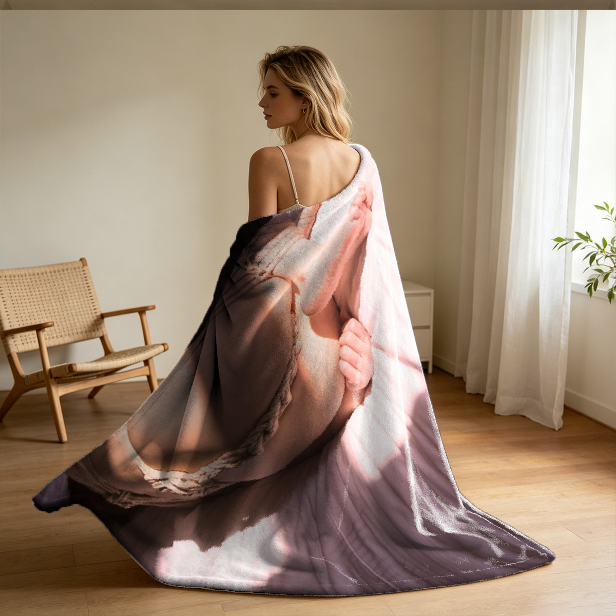 Nude woman kneeling on a rug, looking back over her shoulder in a modern interior. - Blanket
