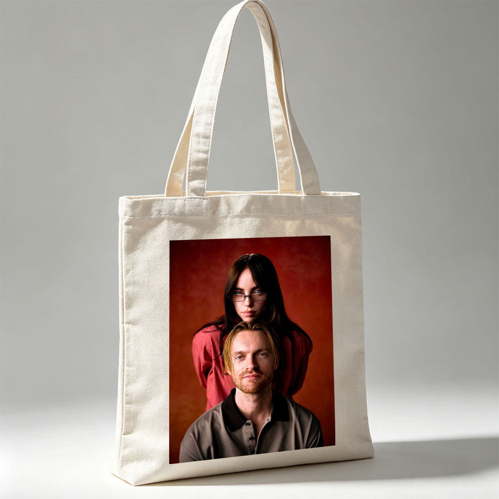 The Postal Service - Portrait of Ben Gibbard and Jenny Lewis Against a Warm Red Background - Canvas tote bags