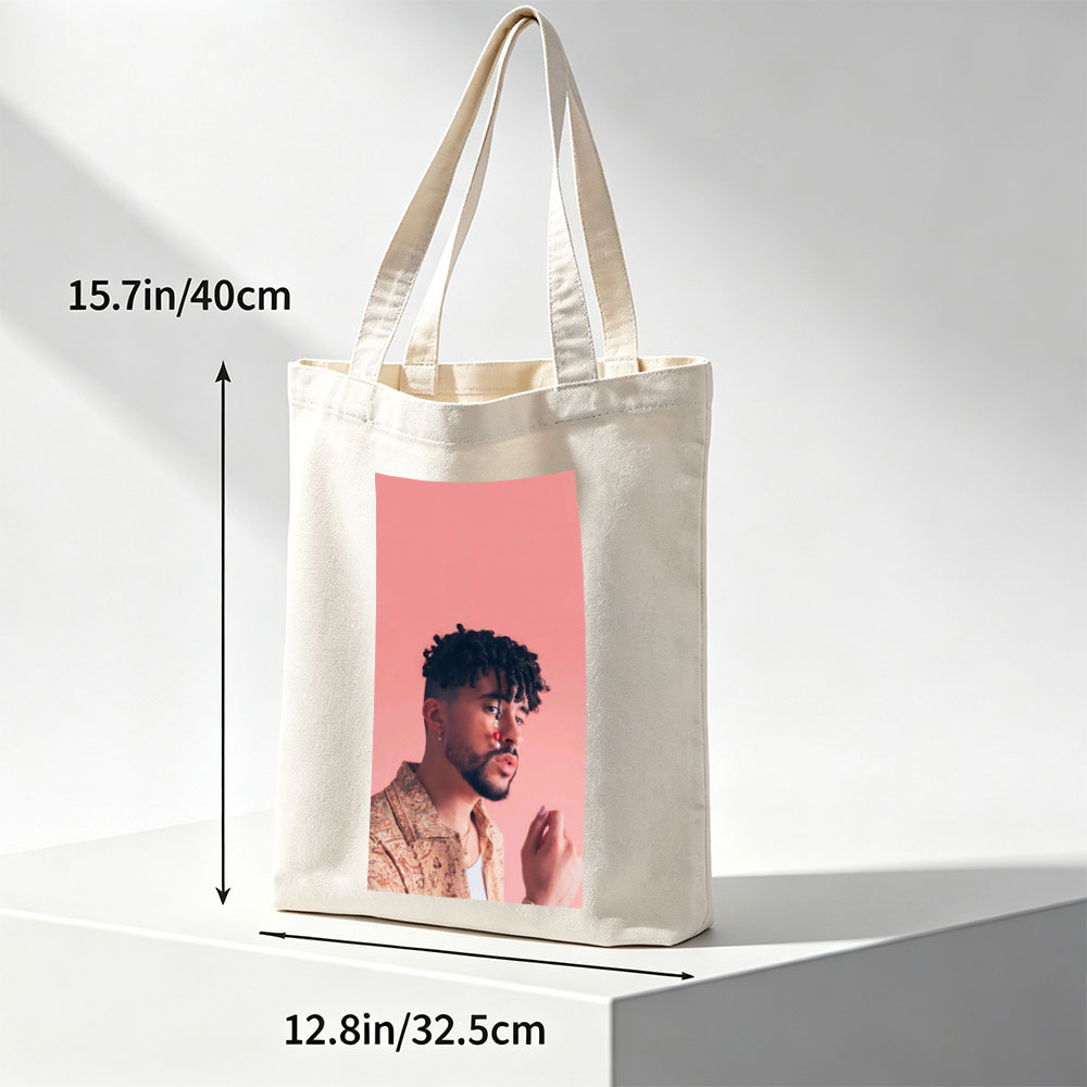 Bad Bunny in a Stylish Pose Against a Pink Background Wearing a Patterned Shirt and Red Nose Jewelry - Canvas tote bags