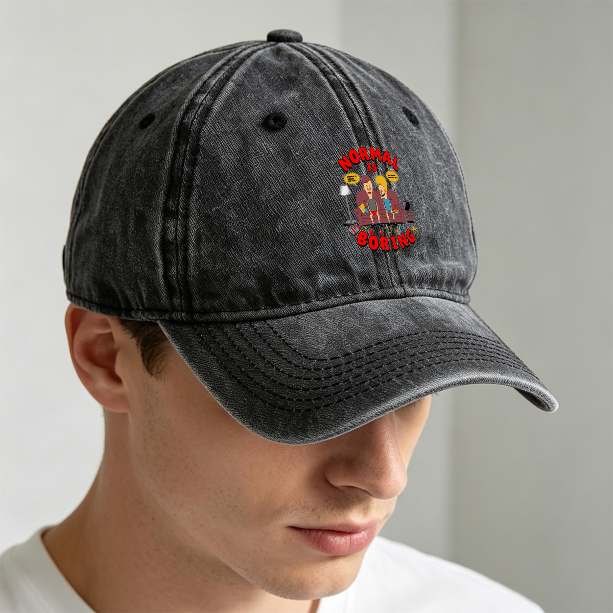 Normal Is Boring: Two Cartoon Characters on Couch with Chaos Around - Washed Denim - Baseball Cap
