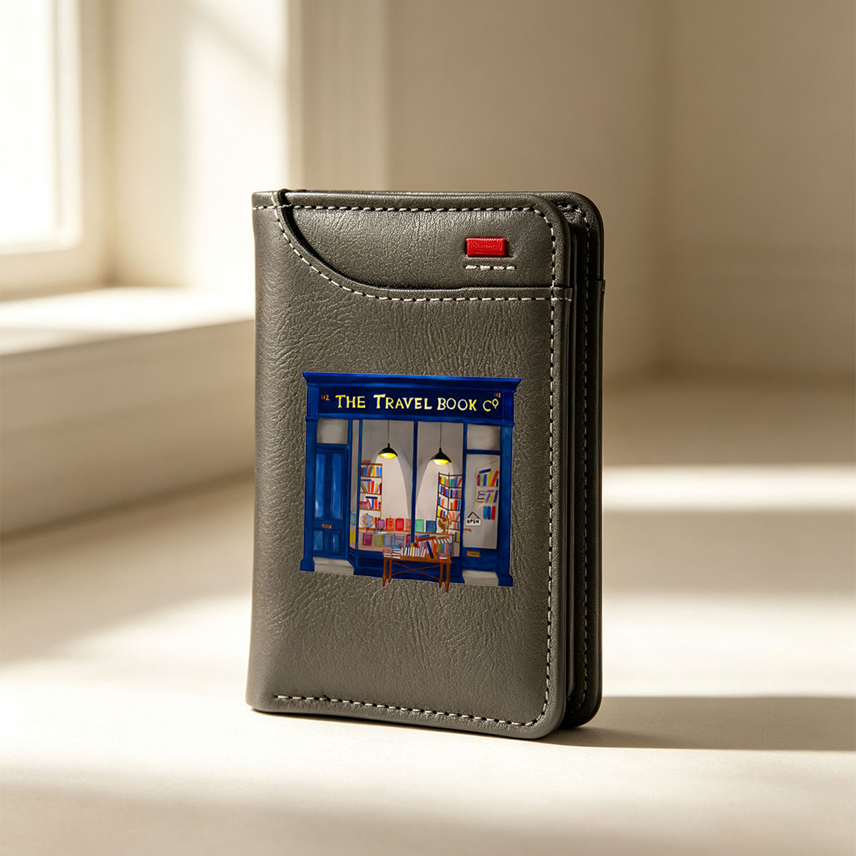The Travel Book Co: A Cozy Bookstore with Colorful Shelves and Open Sign - Vertical Style Wallet