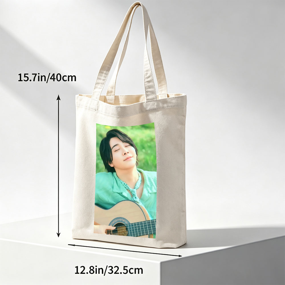 Yuki Kajiura in a Serene Outdoor Setting Playing Acoustic Guitar with Eyes Closed - Canvas tote bags