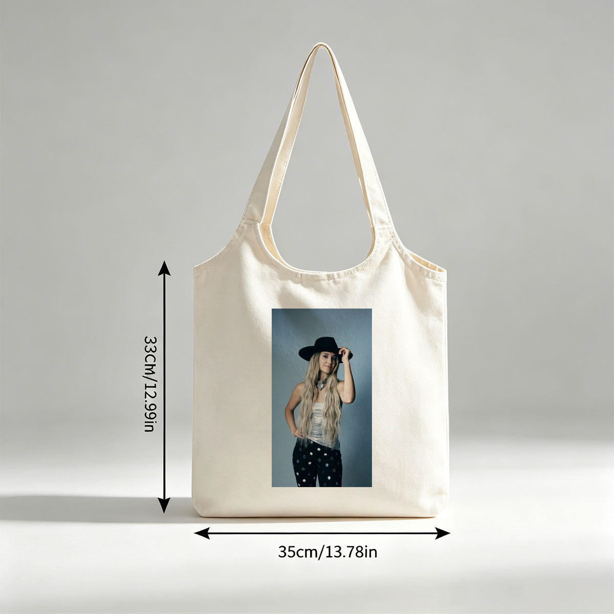 Shania Twain in a Stylish Pose Wearing a Black Hat and Polka Dot Pants - Canvas shoulder bags/