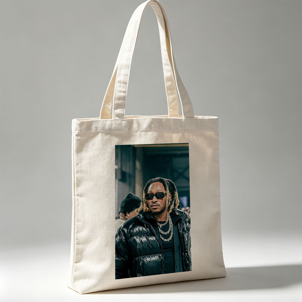 Tory Lanez at a Music Event Wearing a Black Puffer Jacket and Sunglasses - Canvas tote bags