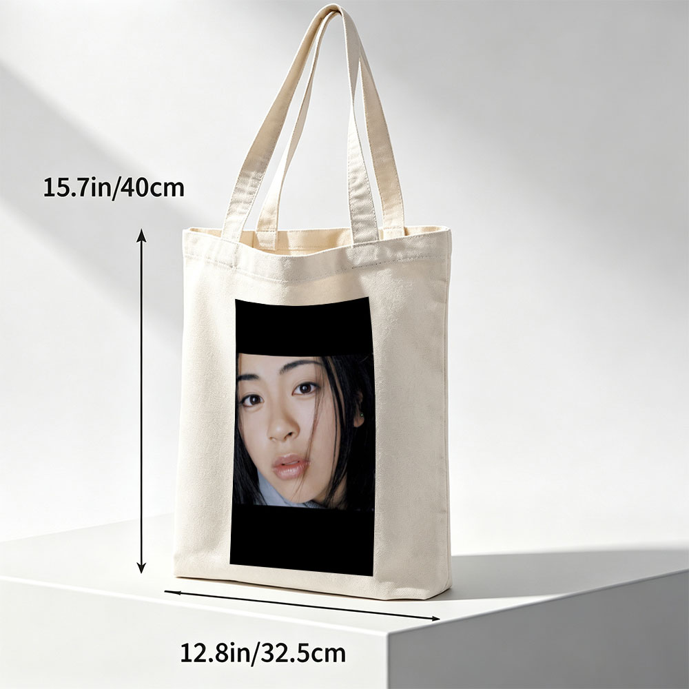 Yuki Kajiura in a Close-Up Portrait with Soft Lighting and Gentle Expression - Canvas tote bags