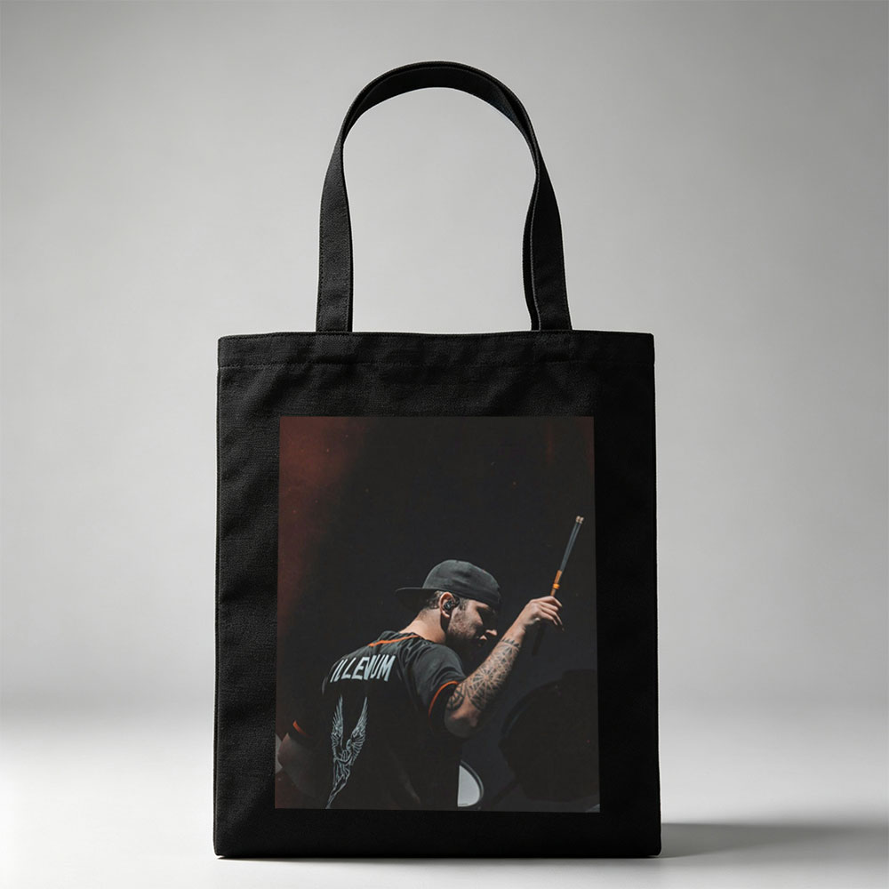 Brent Hinds of Mastodons Performing on Stage with Drumstick in Hand - Canvas tote bags