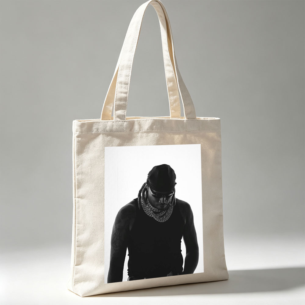 Lil Wayne in a striking black and white portrait wearing a bandana, sunglasses, and a thick chain necklace. - Canvas tote bags