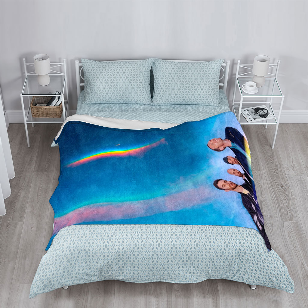 Coldplay in a Cosmic Scene with Rainbow Halo and Starry Sky Background - Blankets