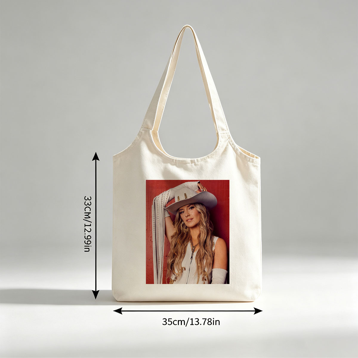Lindsay Ell in a Cowboy Hat and Western Outfit Against a Red Background - Canvas shoulder bags/