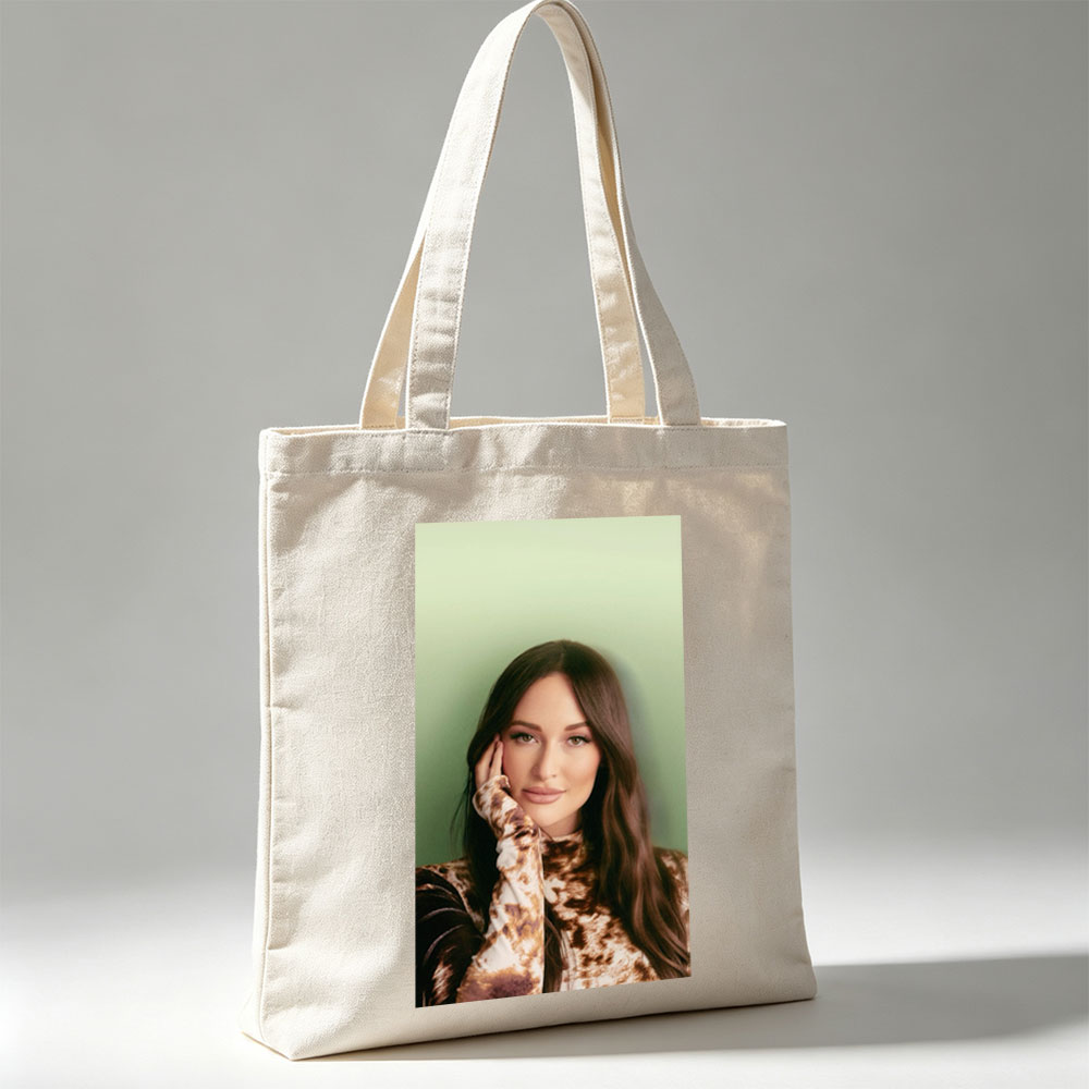 Kendall Rae - Portrait - Woman with Long Brown Hair Wearing Tie-Dye Top Against Green Background - Canvas tote bags