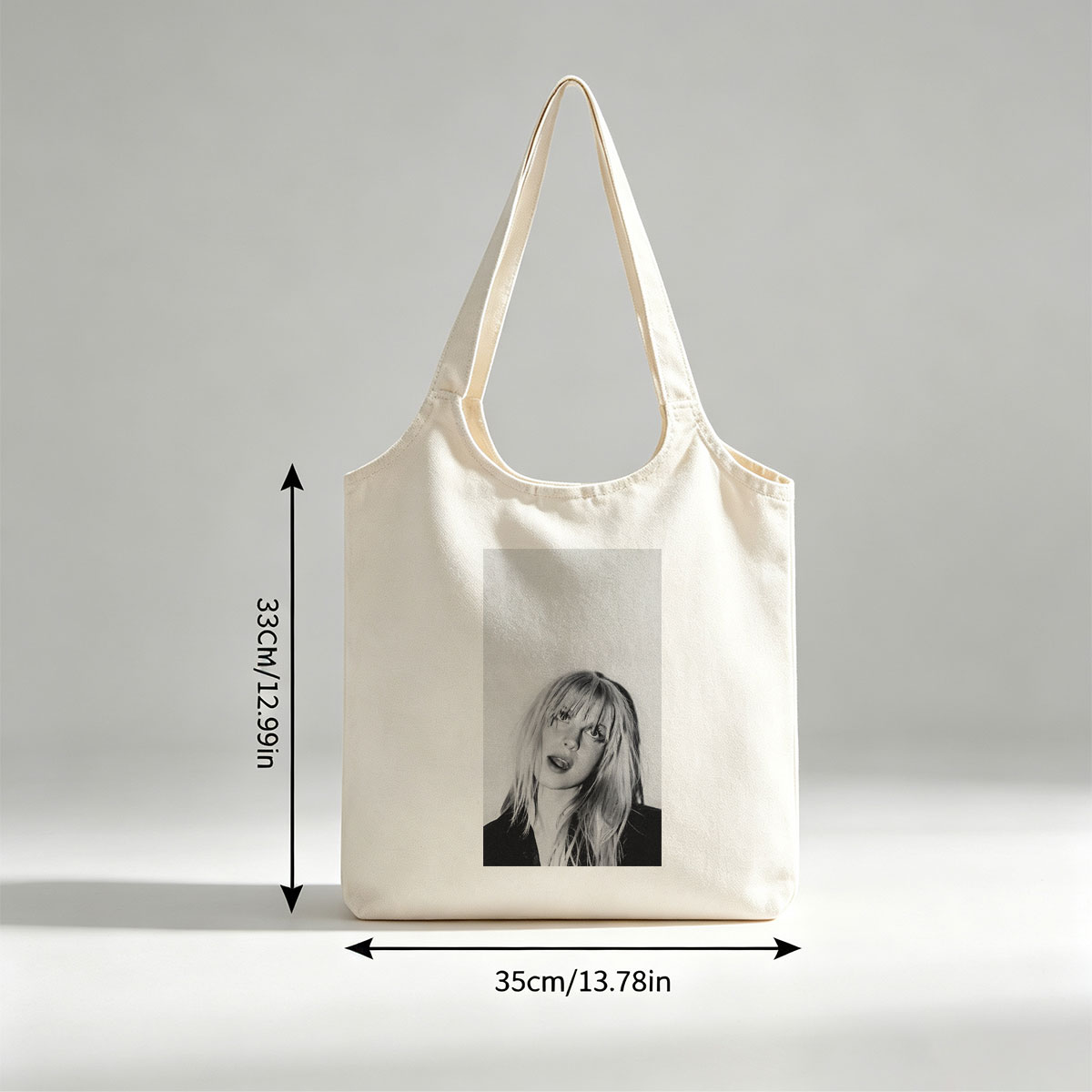 Bebe Rexha in a striking black and white portrait with tousled blonde hair and bold expression - Canvas shoulder bags/