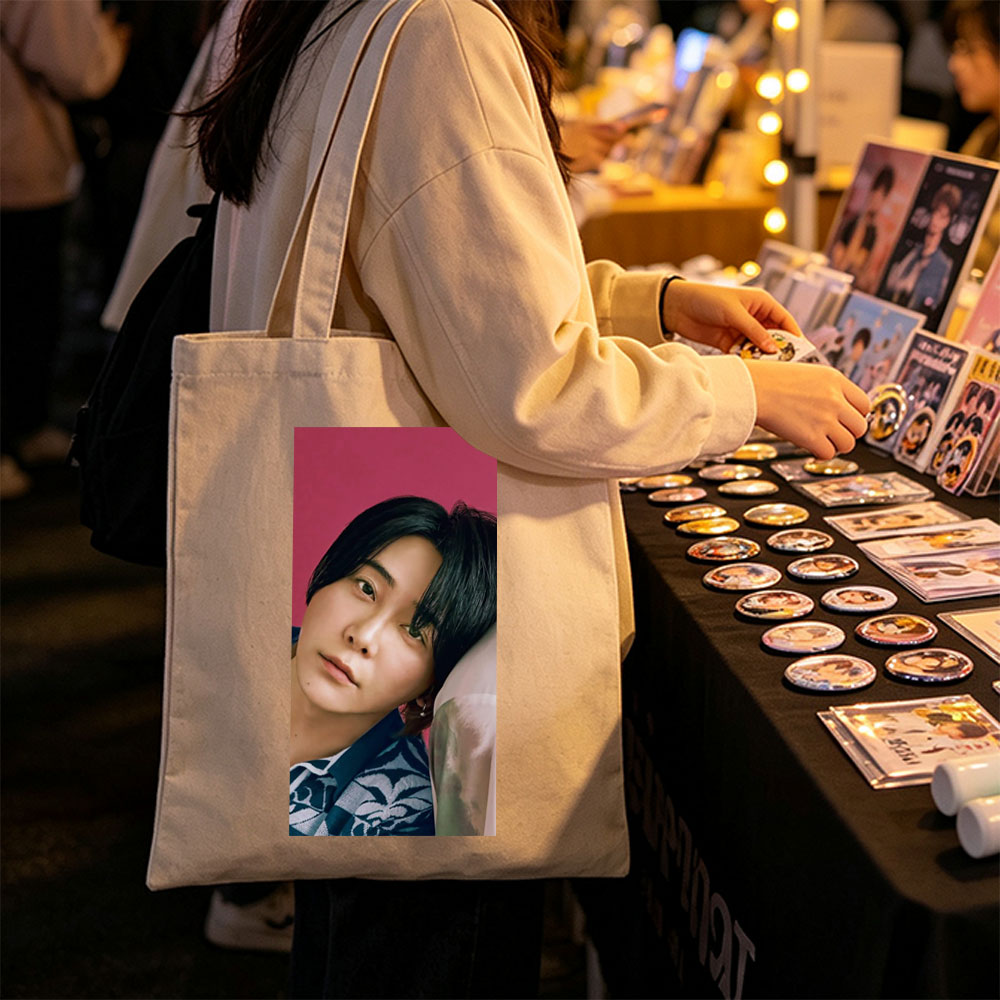 Yoshiki Hayashi in a Serene Pose Against a Vibrant Pink Background Wearing a Traditional Patterned Outfit - Canvas tote bags