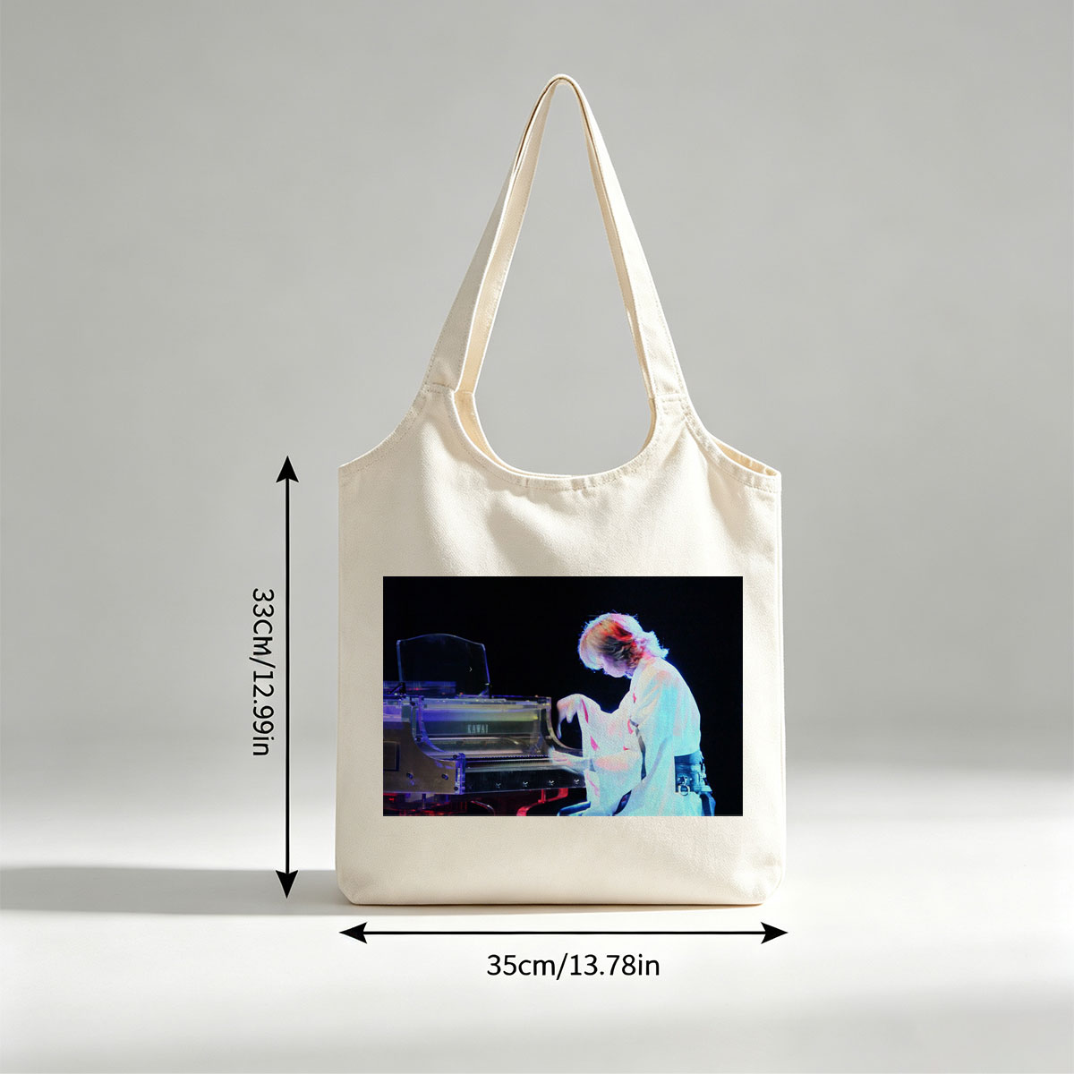 Yuki Kajiura Performing Piano on Stage with Dramatic Lighting - Canvas shoulder bags/