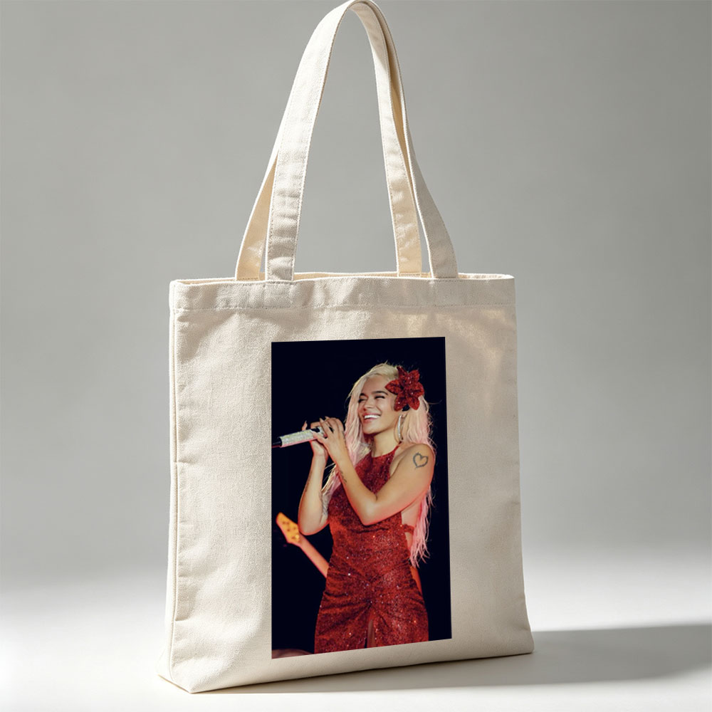 Bebe Rexha Performing on Stage in a Sparkling Red Dress with a Flower Hair Accessory - Canvas tote bags