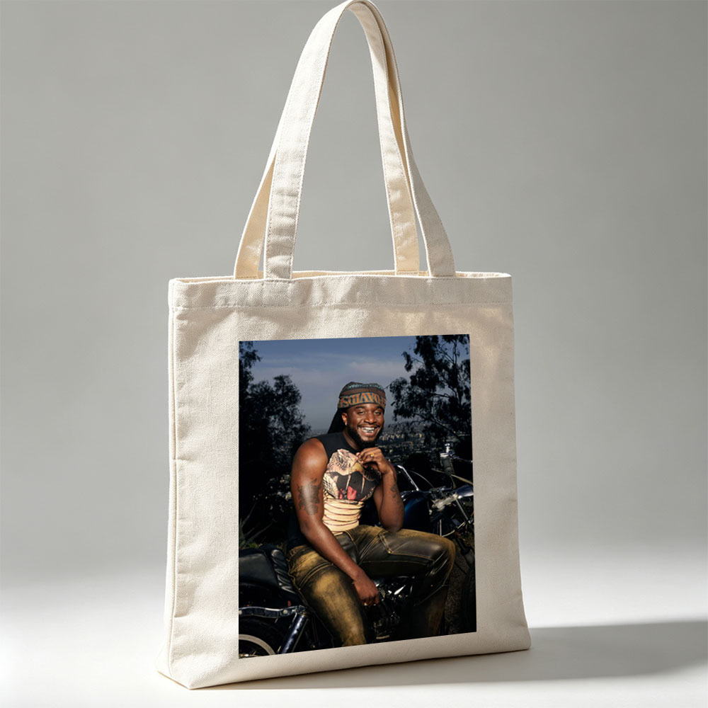 Terry Crews on Motorcycle with City View in Background - Canvas tote bags