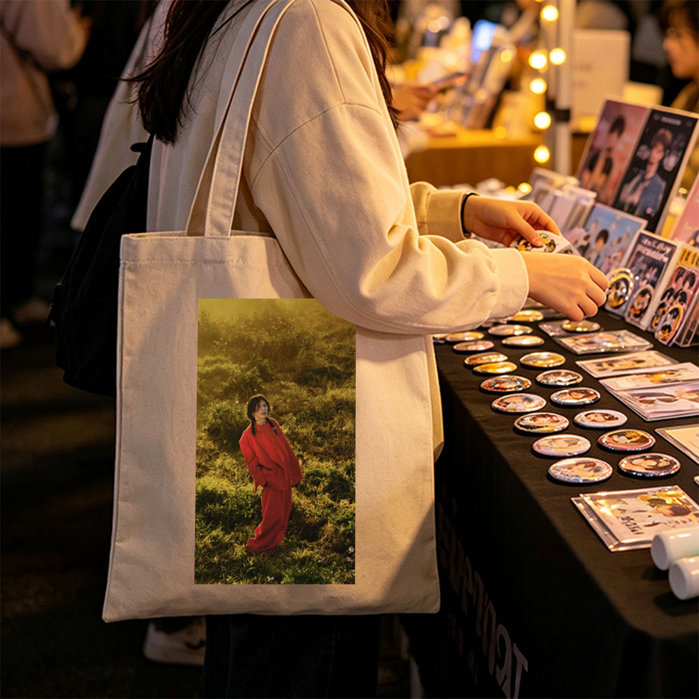 Billie Eilish in a Field Wearing a Red Outfit at Sunset - Canvas tote bags