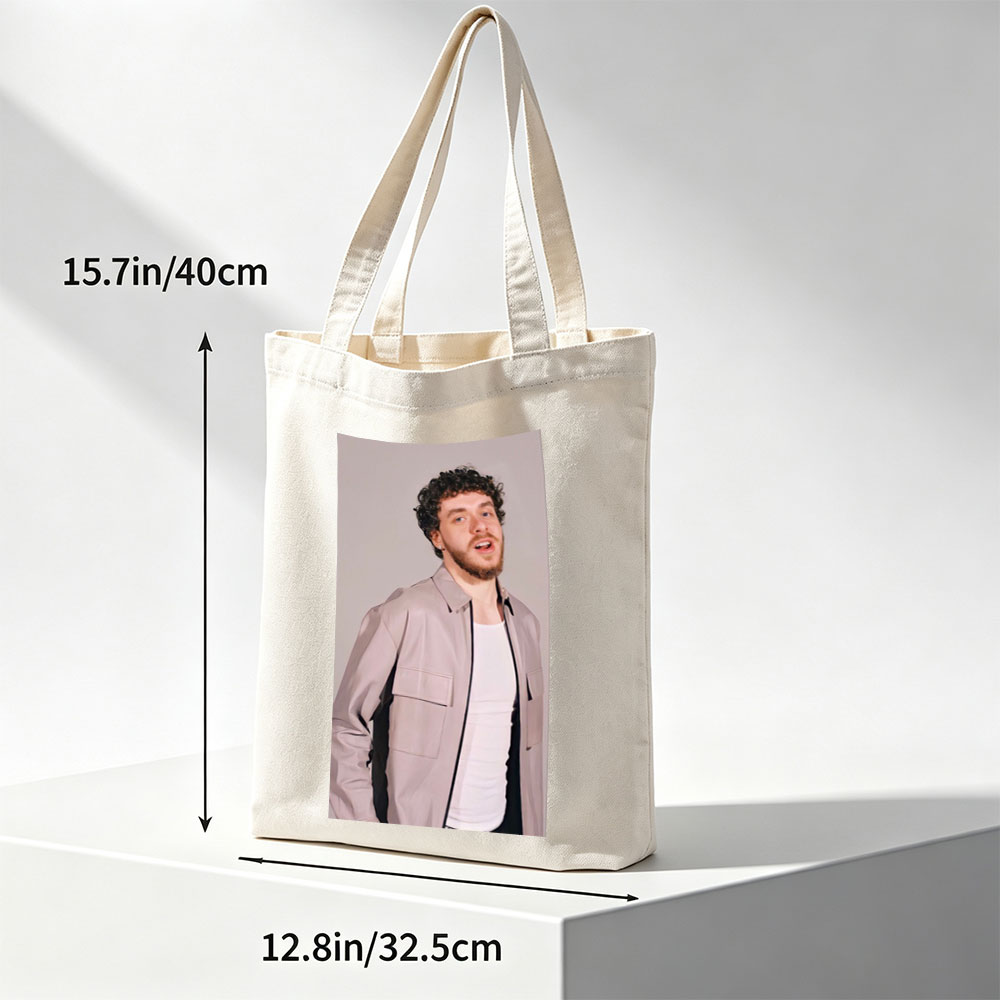Jack Harlow in a Stylish Pose Wearing a Beige Jacket Over a White Shirt Against a Neutral Background - Canvas tote bags