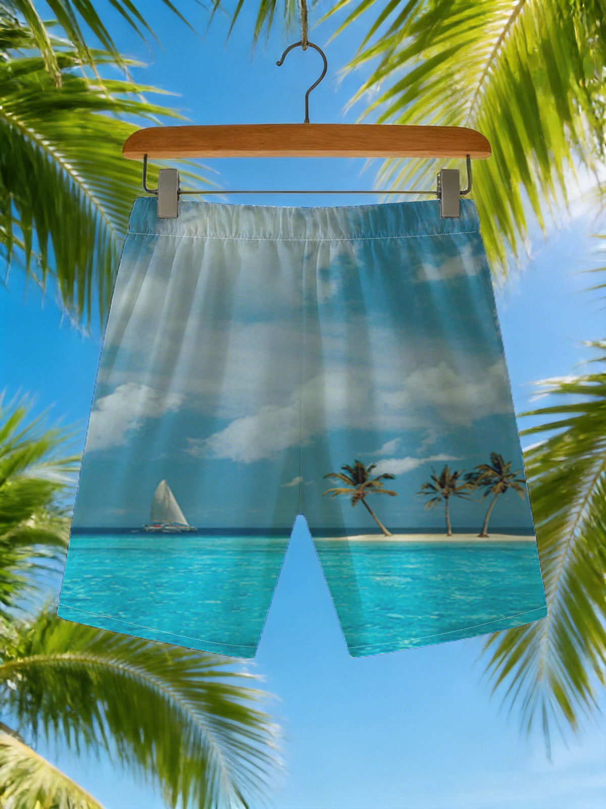 Sailboat near tropical island with palm trees under blue sky -  Beach shorts