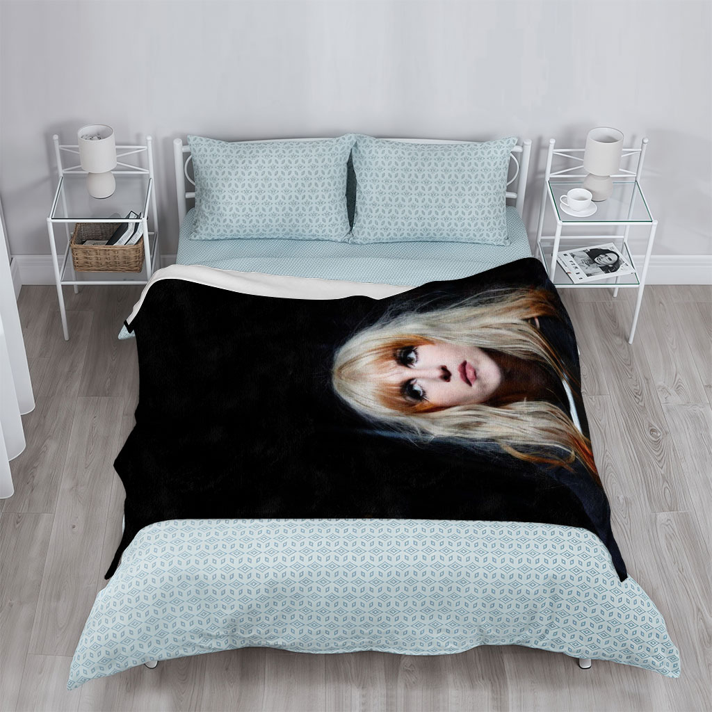 Hayley Williams in a Dramatic Portrait with Intense Gaze and Blonde Hair Against Dark Background - Blankets