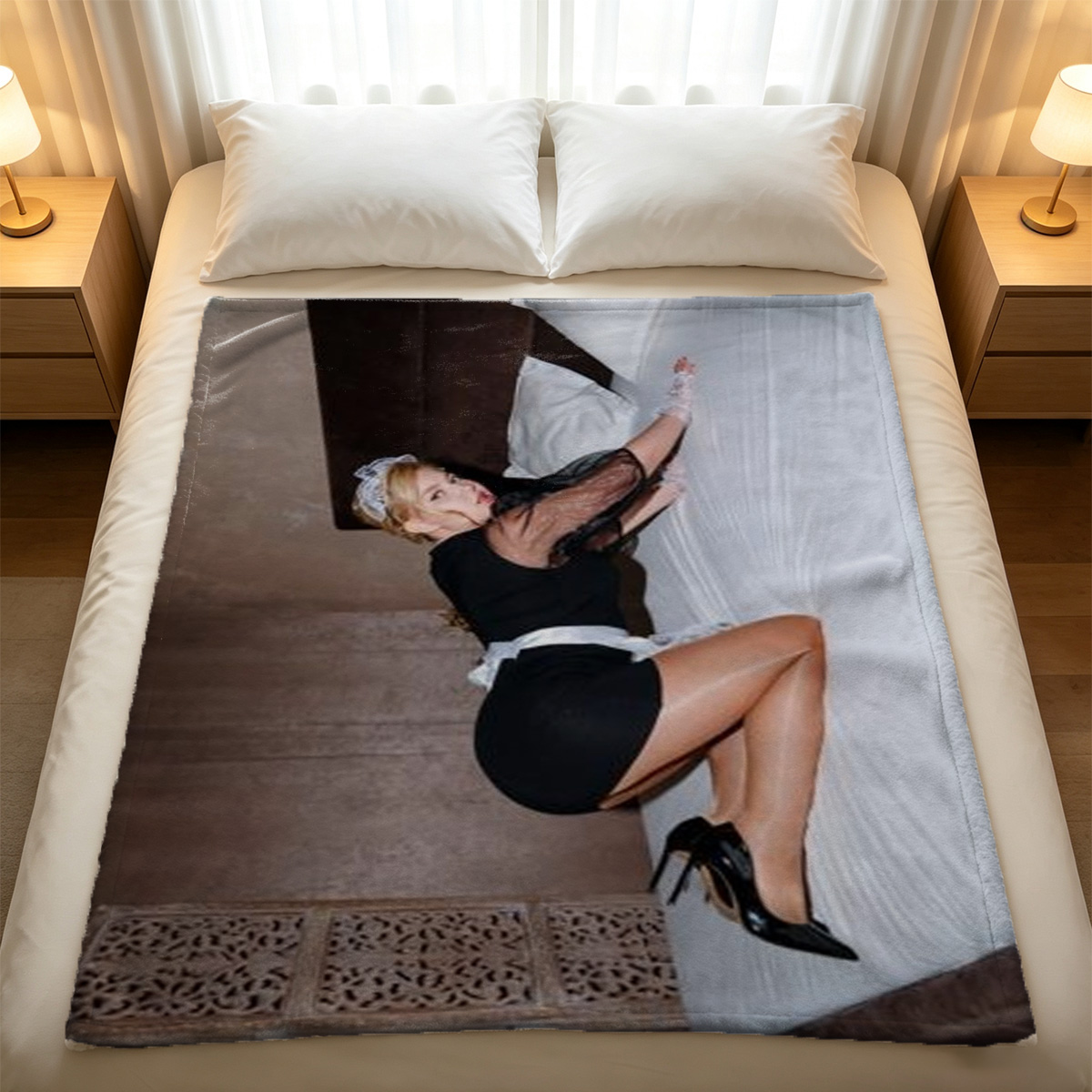 Nude woman lying on inflatable donut on beach - Blanket