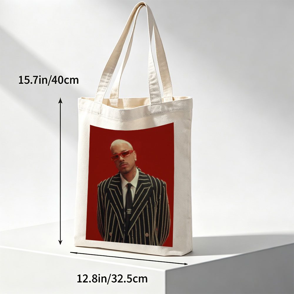 J Balvin in a Striking Red-Background Portrait Wearing a Glittering Black Suit and Red Sunglasses - Canvas tote bags
